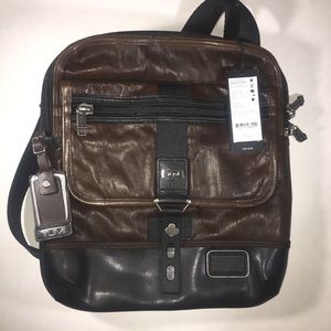 Tumi crossbody leather bag.